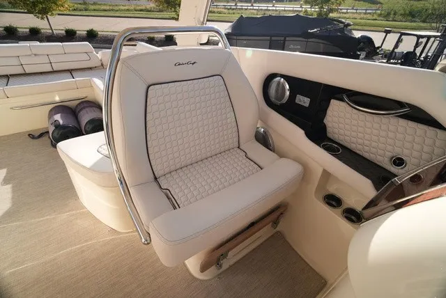 Slide: The Image of Luxurious seating area in a Chris-Craft Launch 35 GT Sterndrive, featuring elegant upholstery and armrests. - 41