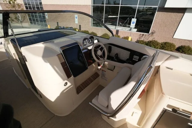 Slide: The Image of The cockpit of a 2026 Chris-Craft Launch 35 GT Sterdrive with sleek controls. - 31