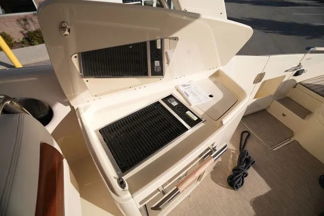 Slide: The Image of The 2026 Chris-Craft Launch 35 GT Sterdrive features a sleek outdoor kitchen with a grill. - 25