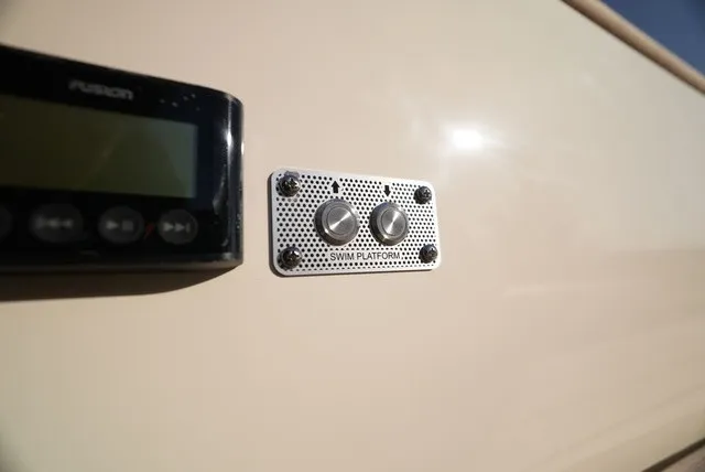 Slide: The Image of Close-up of a control panel on a Chris-Craft boat, next to a display. - 23