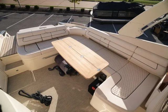 Slide: The Image of The image shows the cockpit of a Chris-Craft Launch 35 GT Sterdrive with beige upholstery and a wooden table. - 20