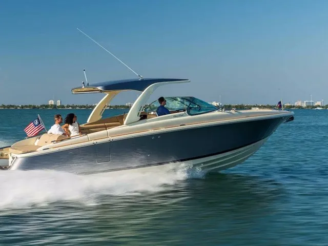 The Image of Chris-Craft Launch 35 GT Sterndrive 2026 on the water with passengers on board. - 1