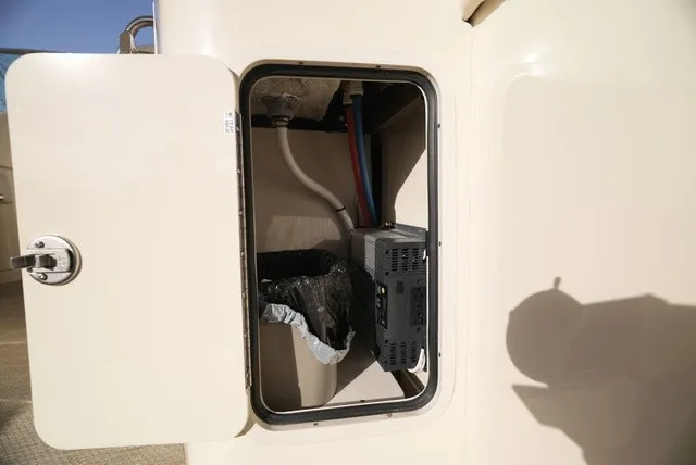 Slide: The Image of An open storage compartment on a Chris-Craft Launch 35 GT Sterndrive boat. - 28