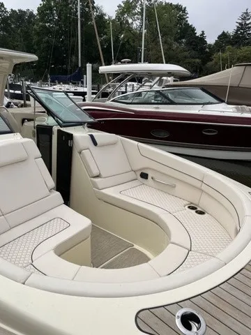 Slide: The Image of The image shows the cockpit of a Chris-Craft Launch 35 GT Sterdrive with sleek, cream-colored seating. - 7