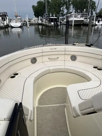 Slide: The Image of The image shows the stern of a Chris-Craft Launch 35 GT Sterdrive with elegant upholstery and harbor view. - 8