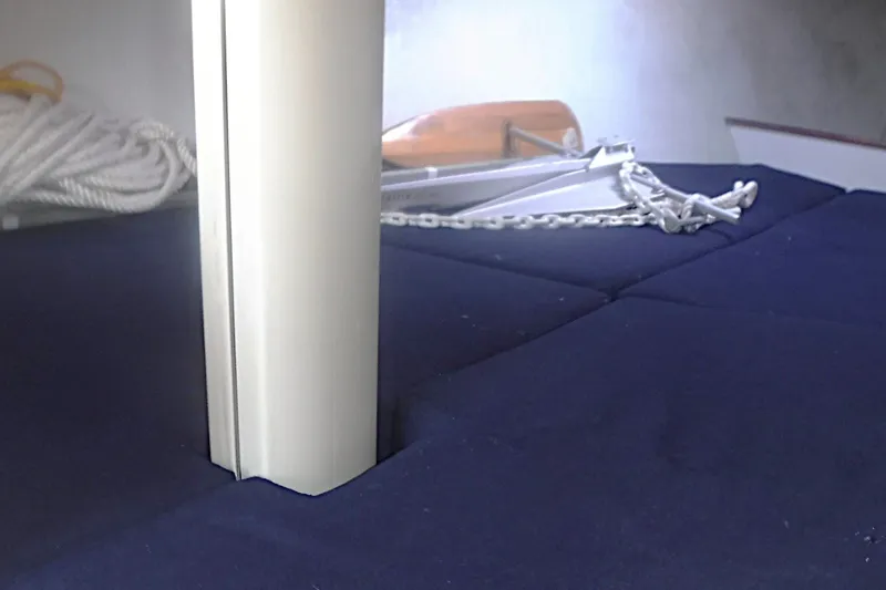 Slide: The Image of Interior of 1997 Alerion Express 28 sailboat with mast and anchor chain. - 46