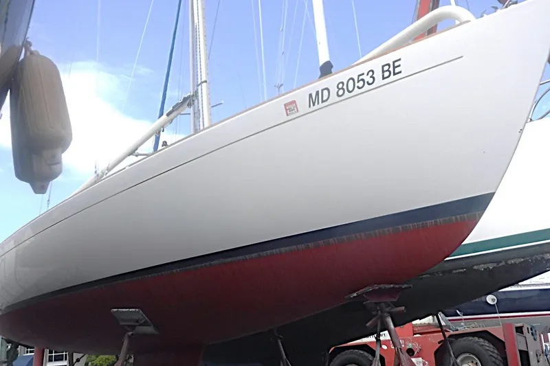 Slide: The Image of 1997 Alerion Express 28 sailboat on dry dock, hull number MD 8053 BE. - 2