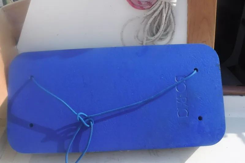 Slide: The Image of Blue boat fender on Alerion Express 28, 1997 model, with rope attached. - 21