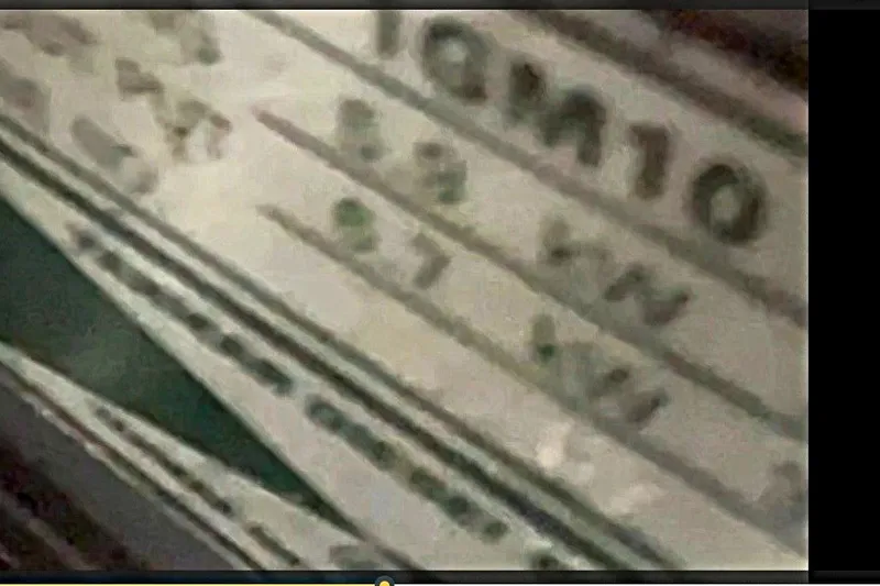 Slide: The Image of Blurry close-up of a label with numbers, possibly from a 1997 Alerion Express 28. - 31