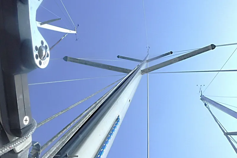 Slide: The Image of Looking up at the mast of a 1997 Alerion Express 28 sailboat against a clear blue sky. - 27
