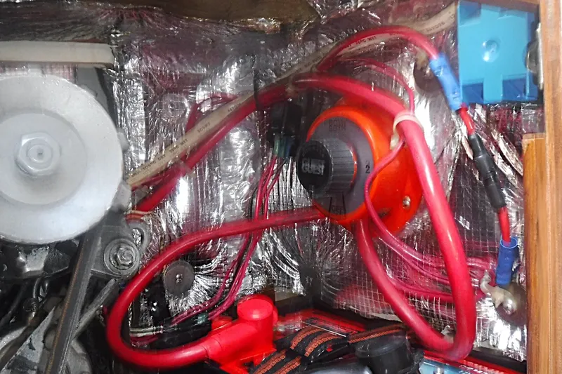 Slide: The Image of Engine compartment of a 1997 Alerion Express 28 with wiring and components. - 34