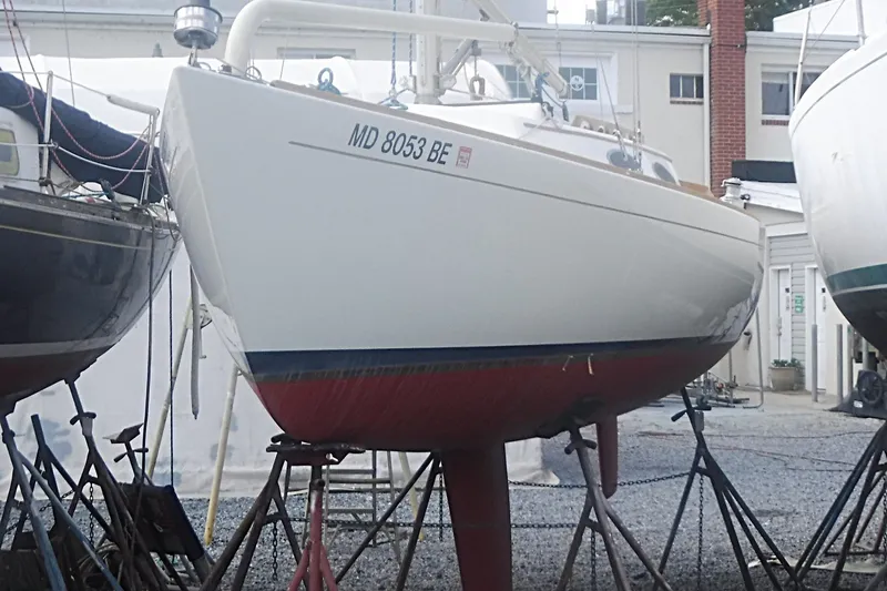 Slide: The Image of Alerion Express 28 sailboat from 1997 on stands in a boatyard. - 4