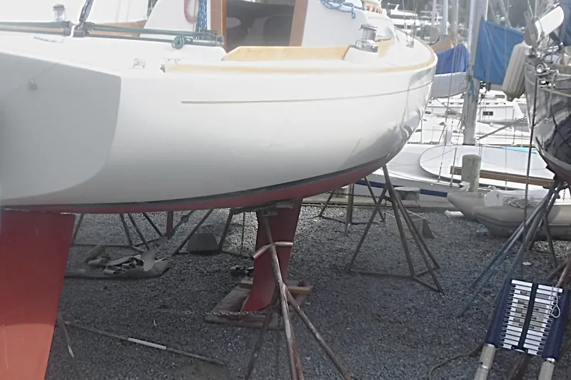 Slide: The Image of Alerion Express 28 sailboat from 1997 on stands in a boatyard. - 7
