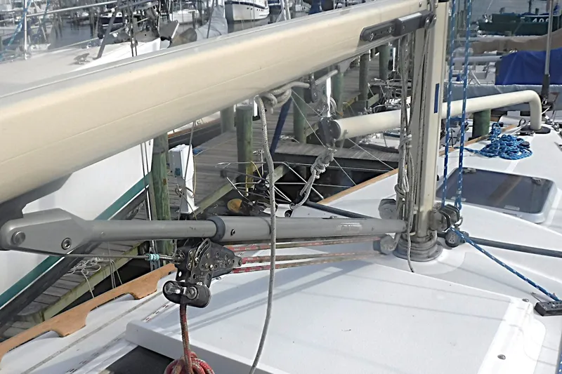 Slide: The Image of Close-up of 1997 Alerion Express 28 sailboat rigging and mast details at a marina. - 19