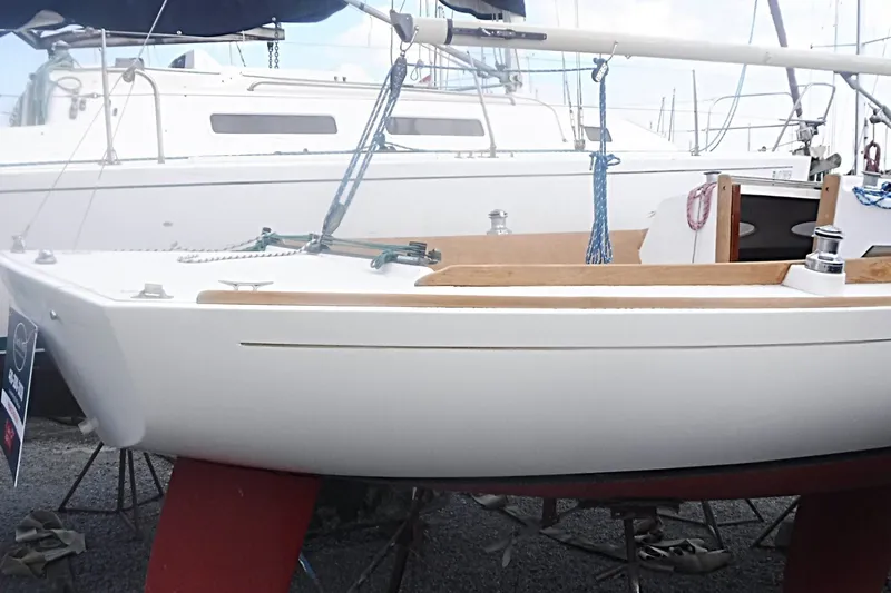 Slide: The Image of Alerion Express 28 sailboat from 1997 on display, featuring sleek design and red keel. - 12