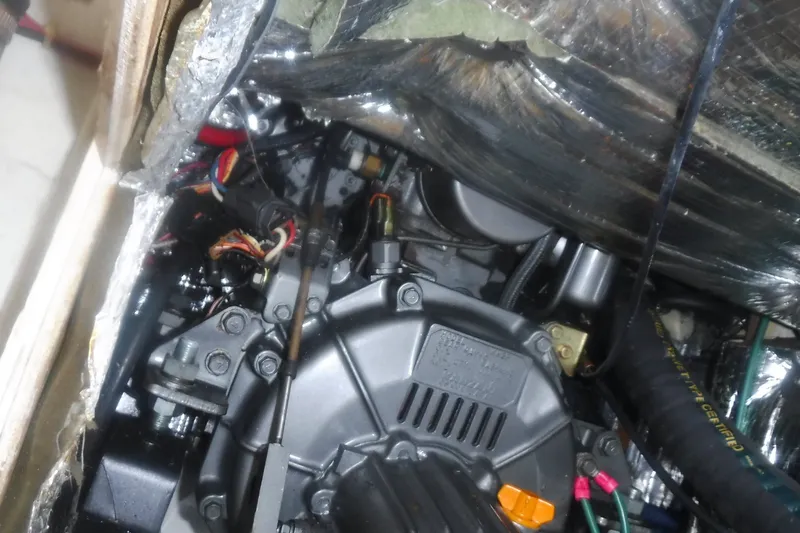 Slide: The Image of Engine compartment of a 1997 Alerion Express 28 sailboat, showcasing mechanical components. - 37