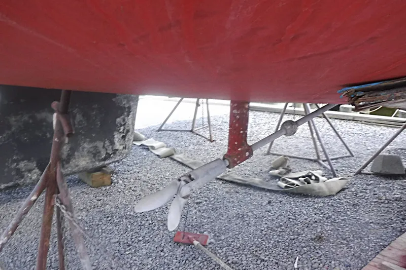 Slide: The Image of Underneath view of a 1997 Alerion Express 28 sailboat with visible propeller and supports. - 9