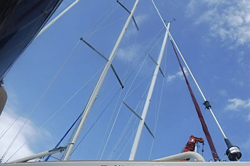 Slide: The Image of Sailboat mast of 1997 Alerion Express 28 against a clear blue sky. - 11