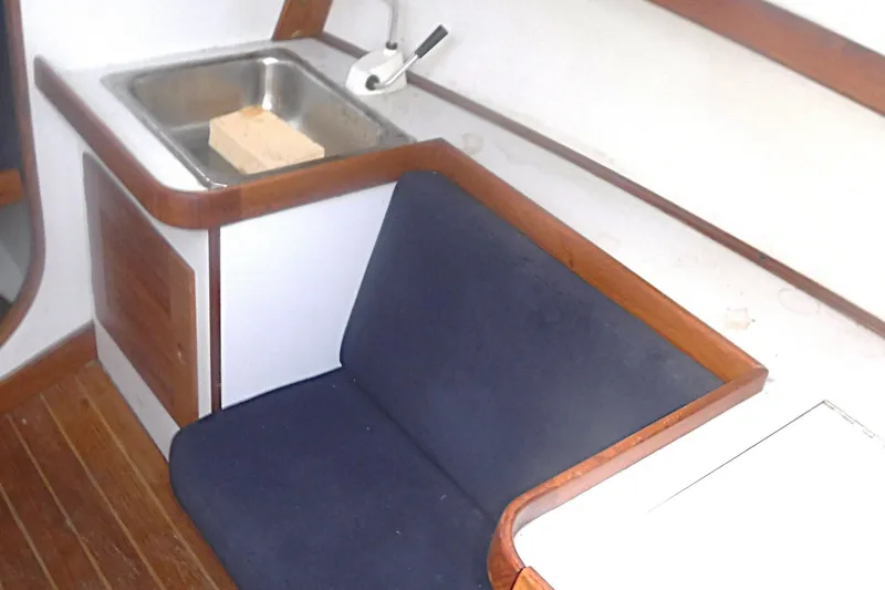 Slide: The Image of Interior of 1997 Alerion Express 28 sailboat with sink and seating area. - 51