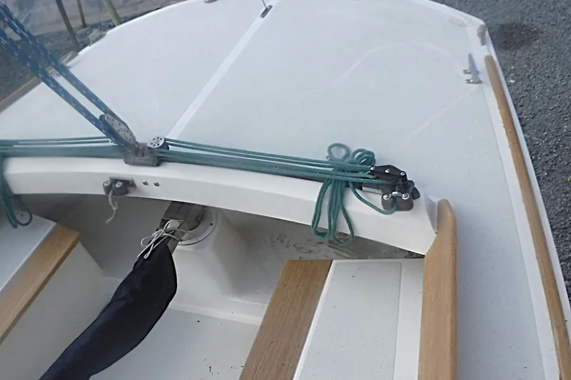 Slide: The Image of 1997 Alerion Express 28 sailboat deck with rigging and wooden trim details. - 16