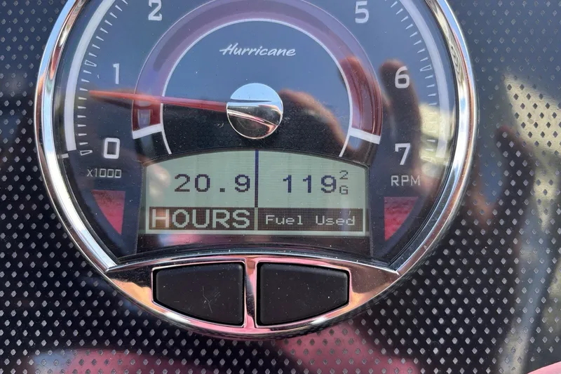 Slide: The Image of Close-up of 2024 Hurricane SunDeck 2600 OB tachometer displaying 20.9 hours and 119 gallons used. - 15