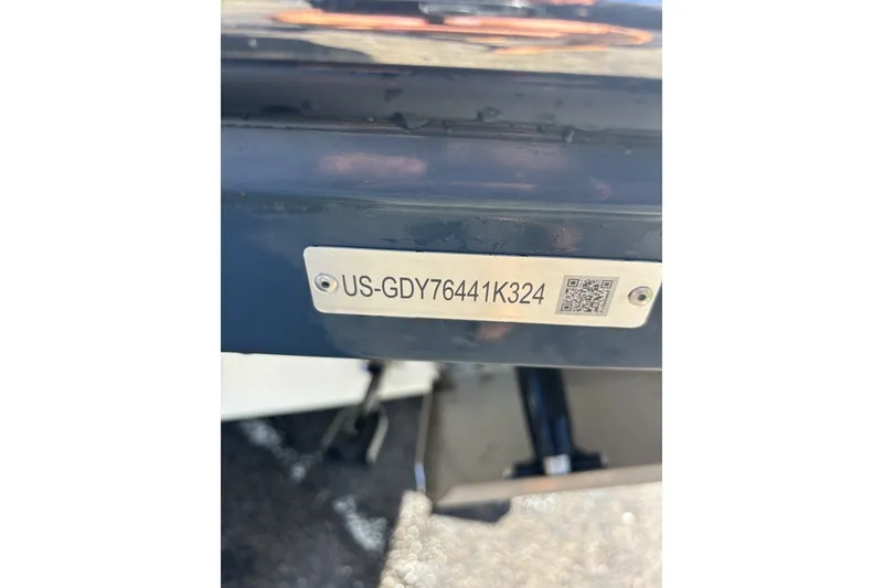 Slide: The Image of 2024 Hurricane SunDeck 2600 OB boat identification plate with QR code. - 16