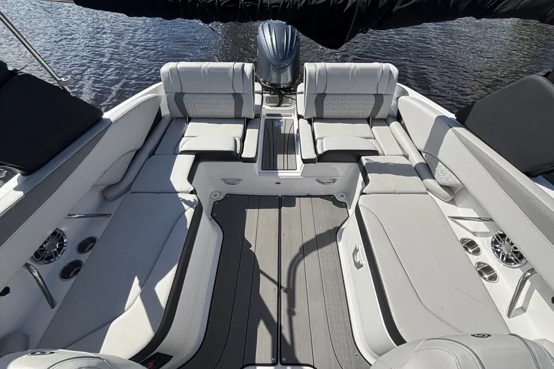 Slide: The Image of 2024 Hurricane SunDeck 2600 OB boat interior with spacious seating and modern design. - 7