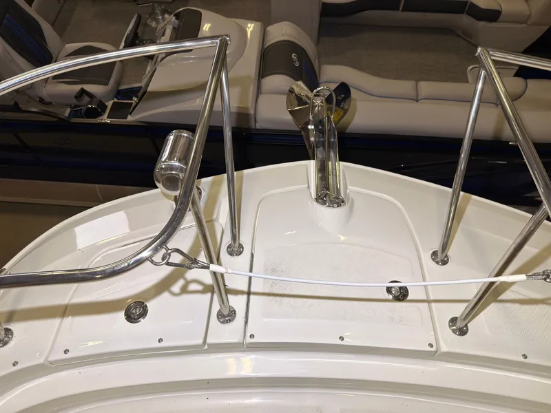 Slide: The Image of The image shows the deck of a Sea Ray Sundancer 320 Outboard with stainless steel railings. - 30