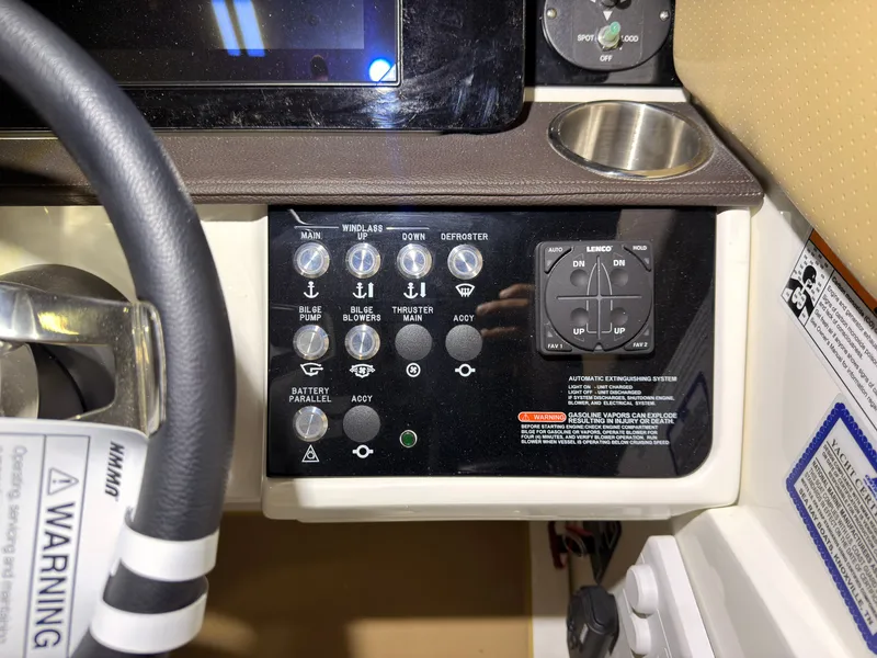 Slide: The Image of The image shows the dashboard of a Sea Ray Sundancer 320 Outboard with various controls and displays. - 19