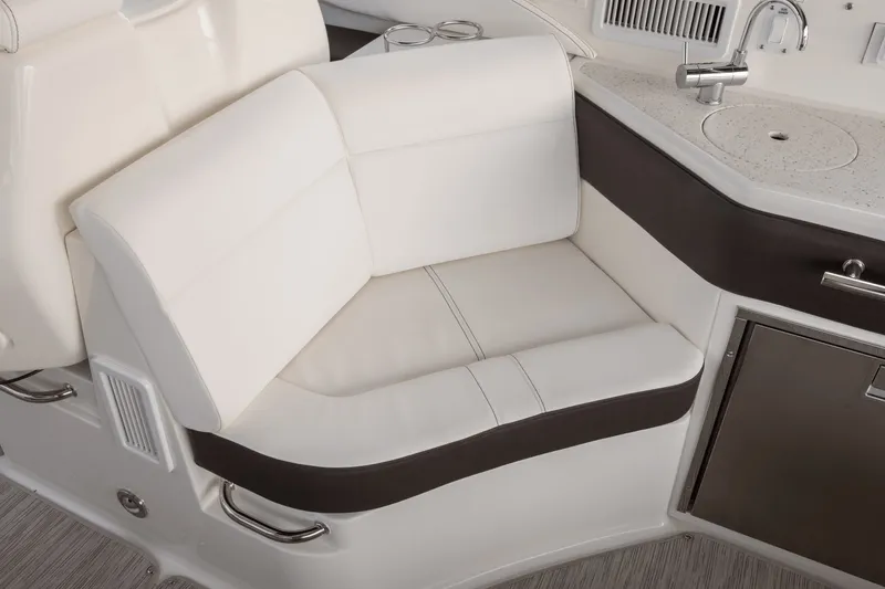 Slide: The Image of Elegant white and brown seating with integrated sink and storage in a modern boat cabin. - 10