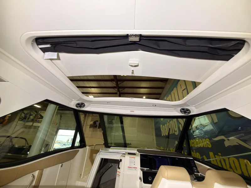 Slide: The Image of Interior view of a Sea Ray Sundancer 320 Outboard with modern design and large windows. - 41
