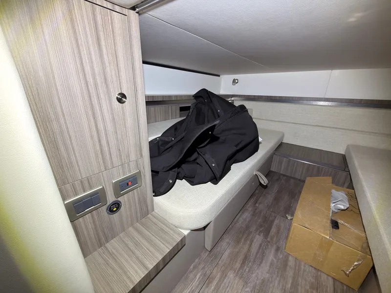Slide: The Image of Interior of a Sea Ray Sundancer 320 Outboard with wood paneling and seating area. - 39