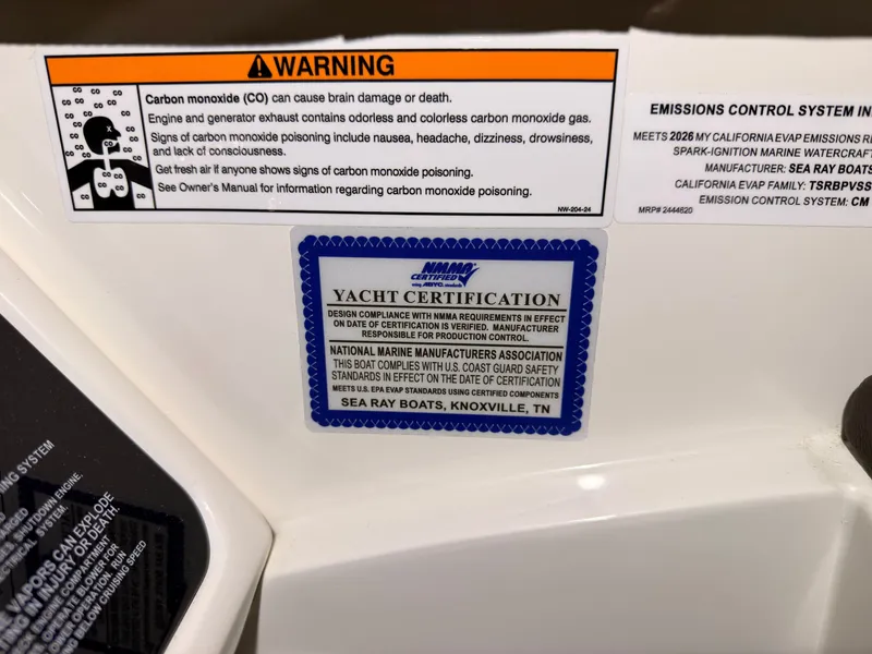Slide: The Image of Warning labels and certification sticker on a boat, including carbon monoxide danger and emissions control system. - 20