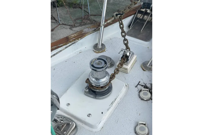 Slide: The Image of Deck of 1986 Slocum 43 sailboat featuring a Maxwell winch and anchor chain. - 18