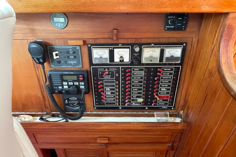 Slide: The Image of Electrical control panel on a 1986 Slocum 43 sailboat, featuring gauges and switches. - 38