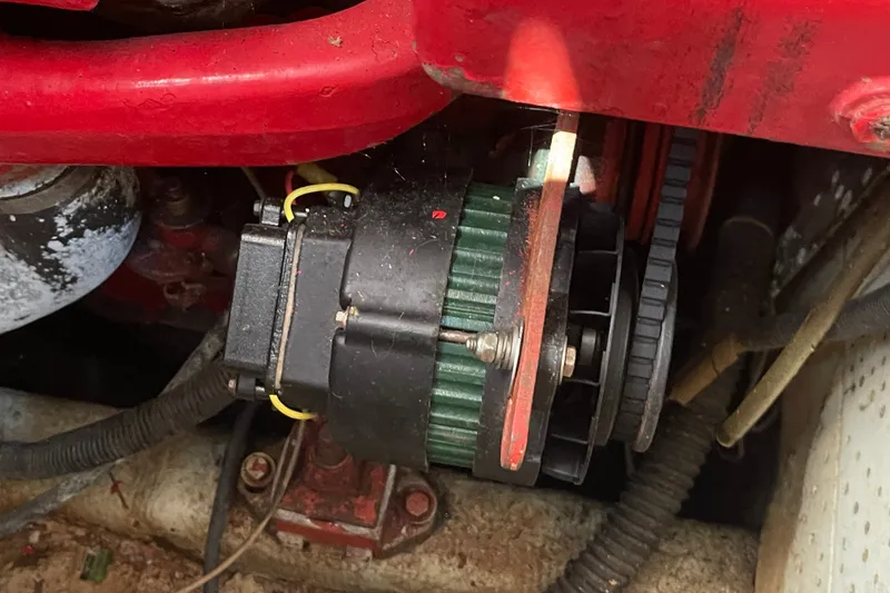 Slide: The Image of Close-up of a 1986 Slocum 43 engine component with red and green parts. - 51