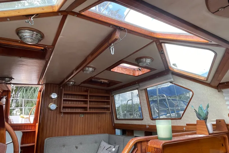 Slide: The Image of Interior of a 1986 Slocum 43 sailboat with wooden accents and skylights. - 22