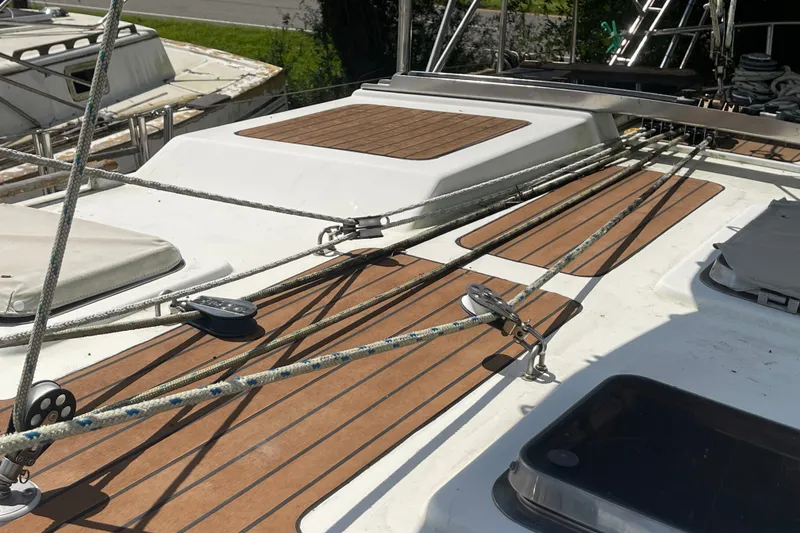 Slide: The Image of Deck of 1986 Slocum 43 sailboat with rigging and teak accents. - 14