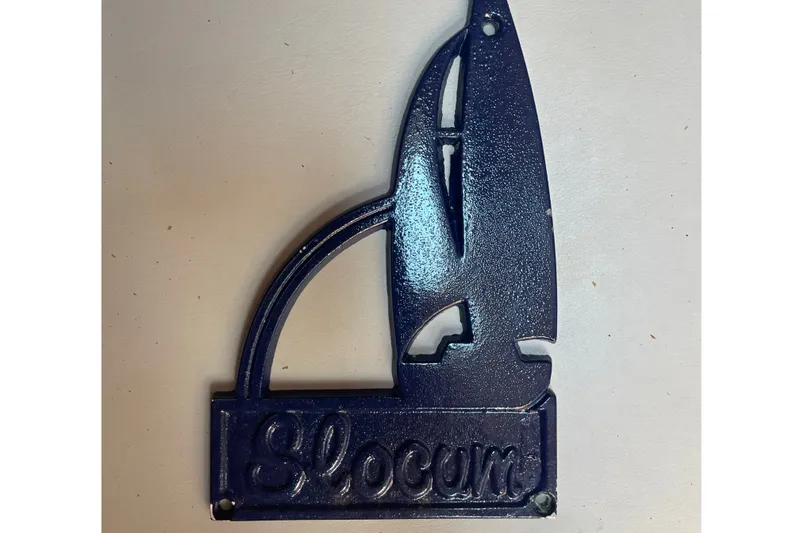Slide: The Image of Blue metal plaque with sailboat design and "Slocum" text, 1986 Slocum 43 model. - 40