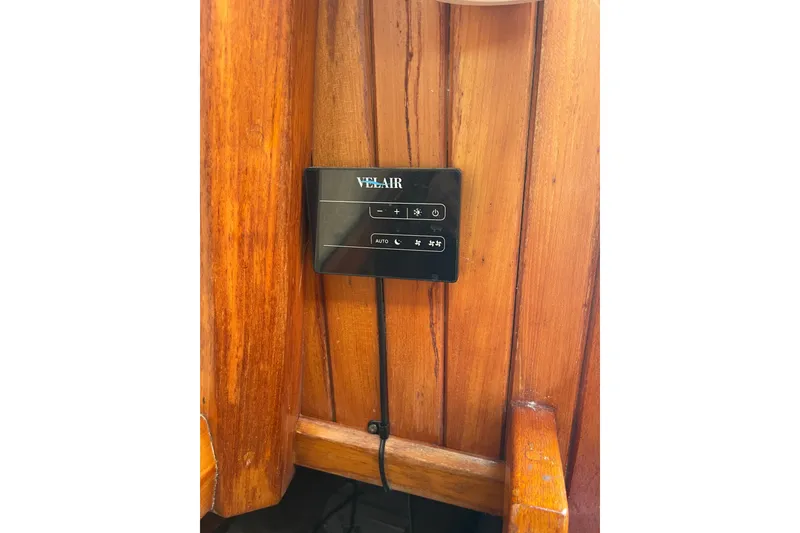 Slide: The Image of Control panel on wooden interior of 1986 Slocum 43 sailboat. - 54
