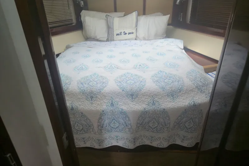 Slide: The Image of Cozy bedroom with patterned bedding in 2010 Sea Ray 580 Sundancer yacht. - 62
