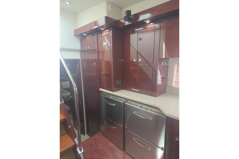 Slide: The Image of Luxurious interior of 2010 Sea Ray 580 Sundancer yacht with modern cabinetry and appliances. - 45