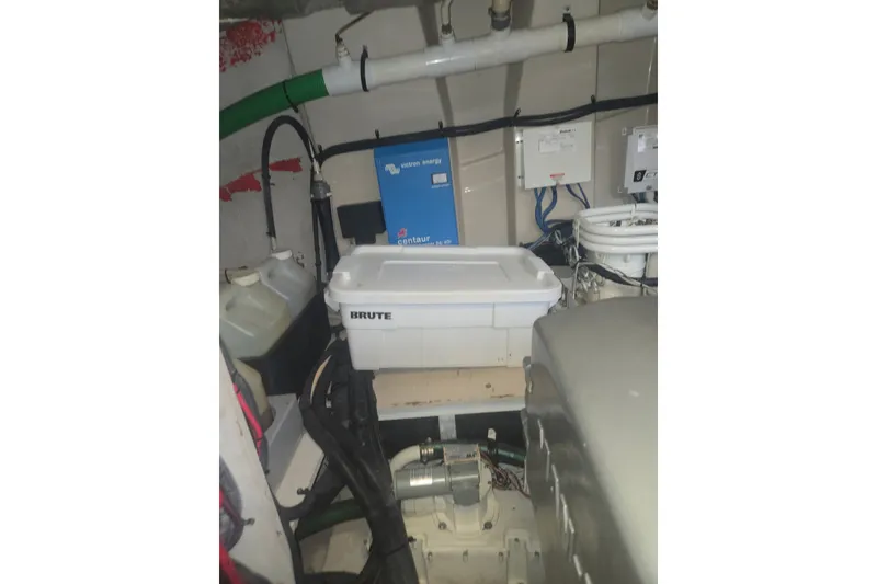 Slide: The Image of Engine room of 2010 Sea Ray 580 Sundancer with equipment and storage container. - 67