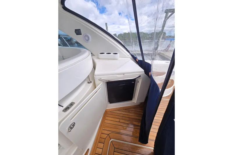 Slide: The Image of 2010 Sea Ray 580 Sundancer interior with teak flooring and sleek cabinetry. - 38