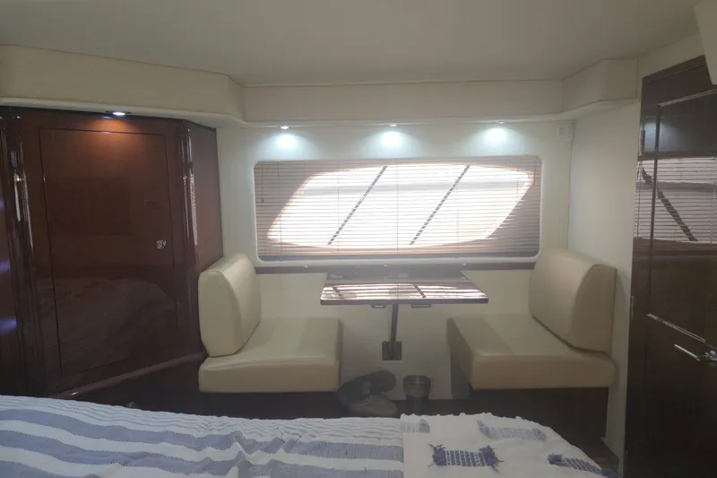 Slide: The Image of Interior of 2010 Sea Ray 580 Sundancer yacht with cozy seating and table. - 51