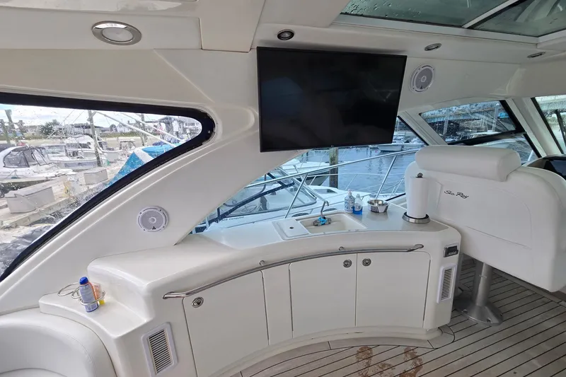 Slide: The Image of Luxurious interior of 2010 Sea Ray 580 Sundancer yacht with TV and seating area. - 29