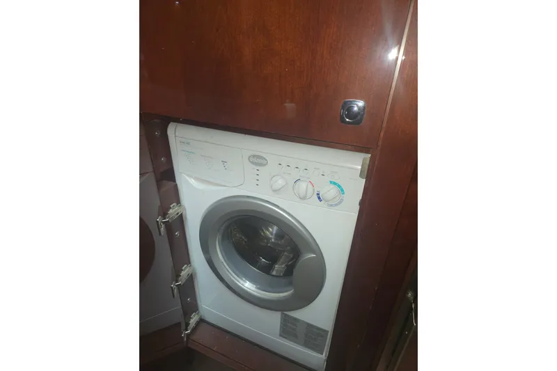 Slide: The Image of Washing machine inside 2010 Sea Ray 580 Sundancer yacht, wooden cabinetry. - 53
