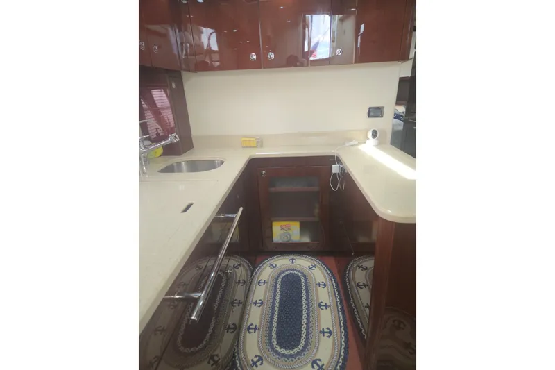 Slide: The Image of Luxurious kitchen interior of 2010 Sea Ray 580 Sundancer yacht with modern amenities. - 46