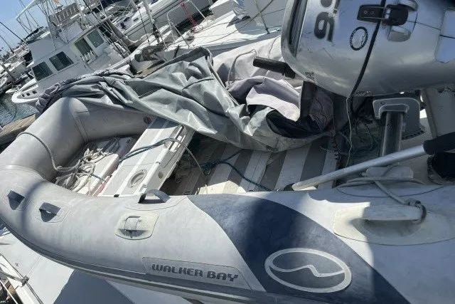 Slide: The Image of Inflatable Walker Bay boat on a 1990 Catalina 42 yacht deck. - 41