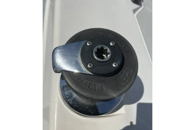 Slide: The Image of Winch on 1990 Catalina 42 sailboat deck, featuring a Lewmar 52 model. - 28